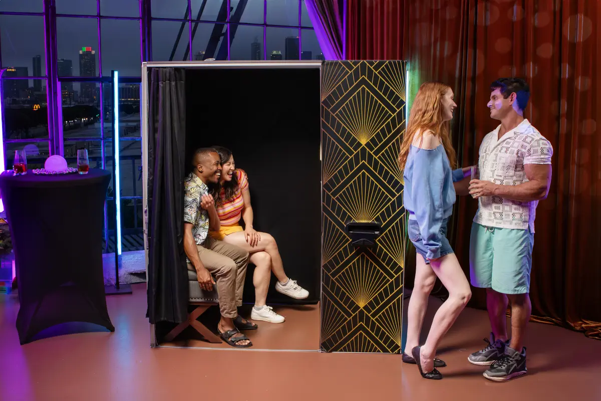 Enclosed photo booth corporate event Los Angeles — classic curtained booth rental — Captured Celebrations