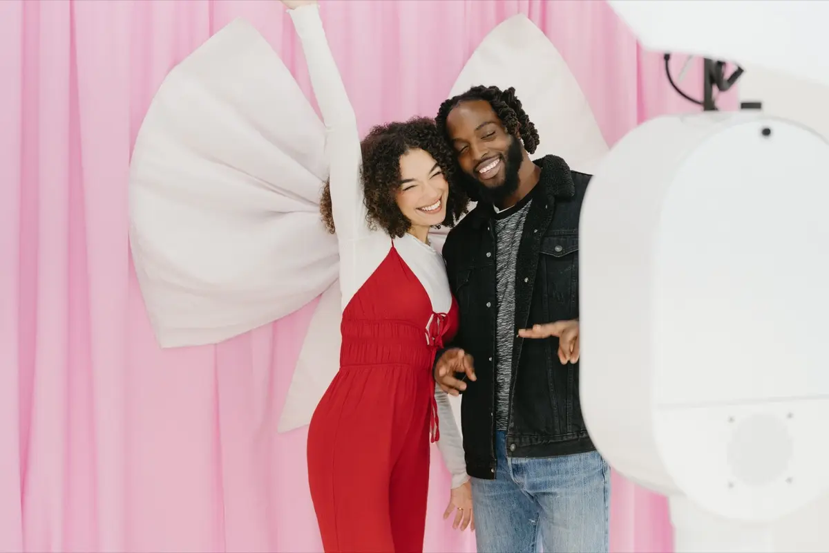 Bridal photo booth with pink bow backdrop at a Los Angeles wedding