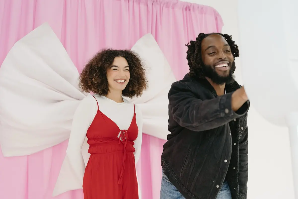 Bridal photo booth pink bow backdrop with digital overlay integration