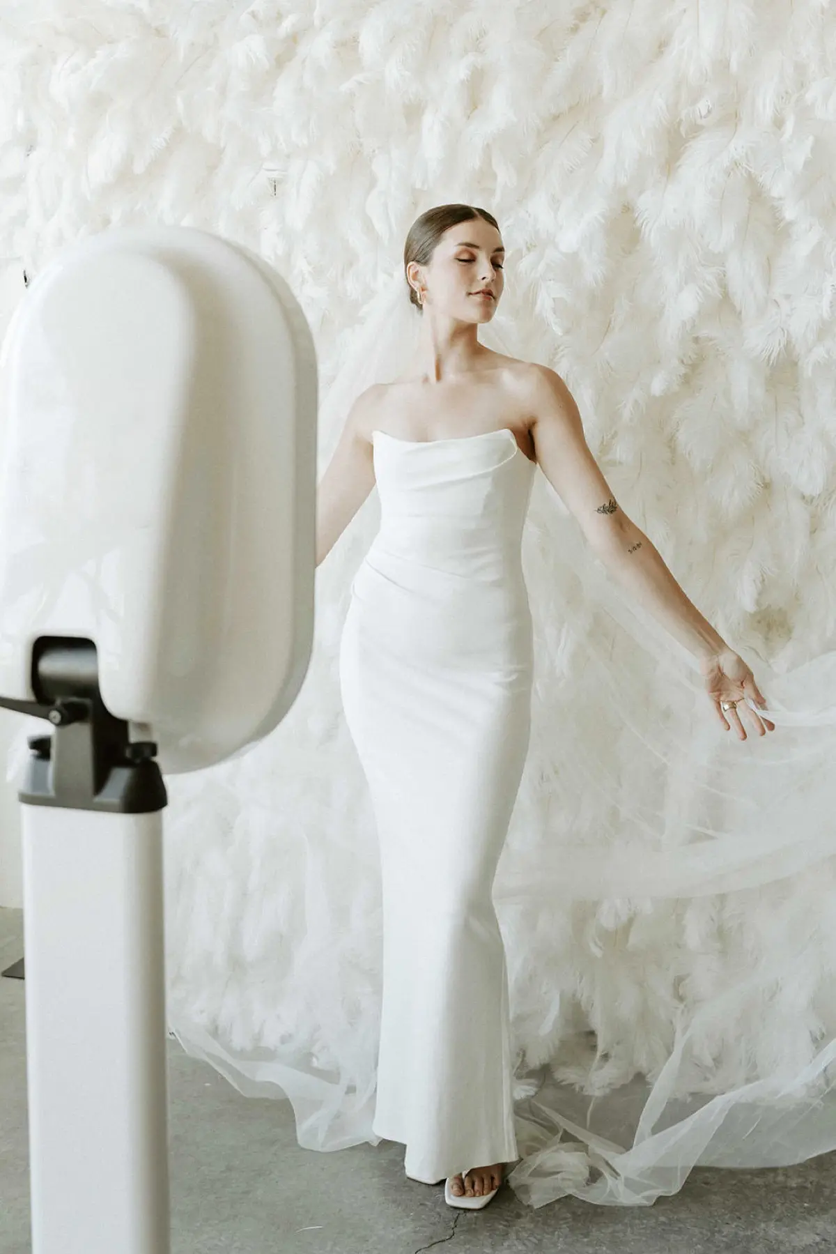 Feather photo booth backdrop at a Los Angeles celebration