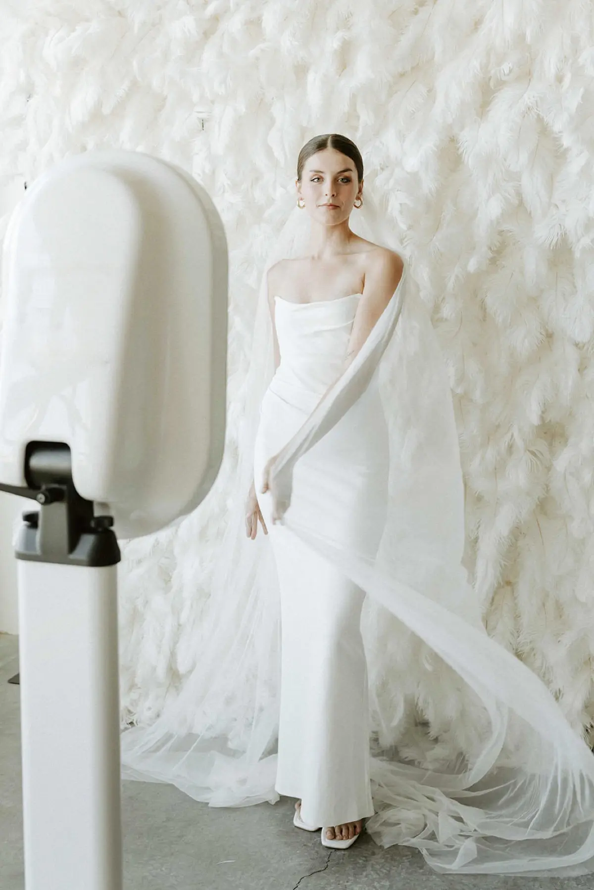 Feather and floral backdrop for photo booth rental in Los Angeles