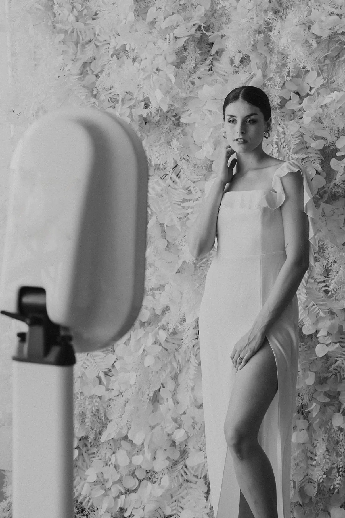 Pampas grass and floral photo booth backdrop at a Los Angeles venue