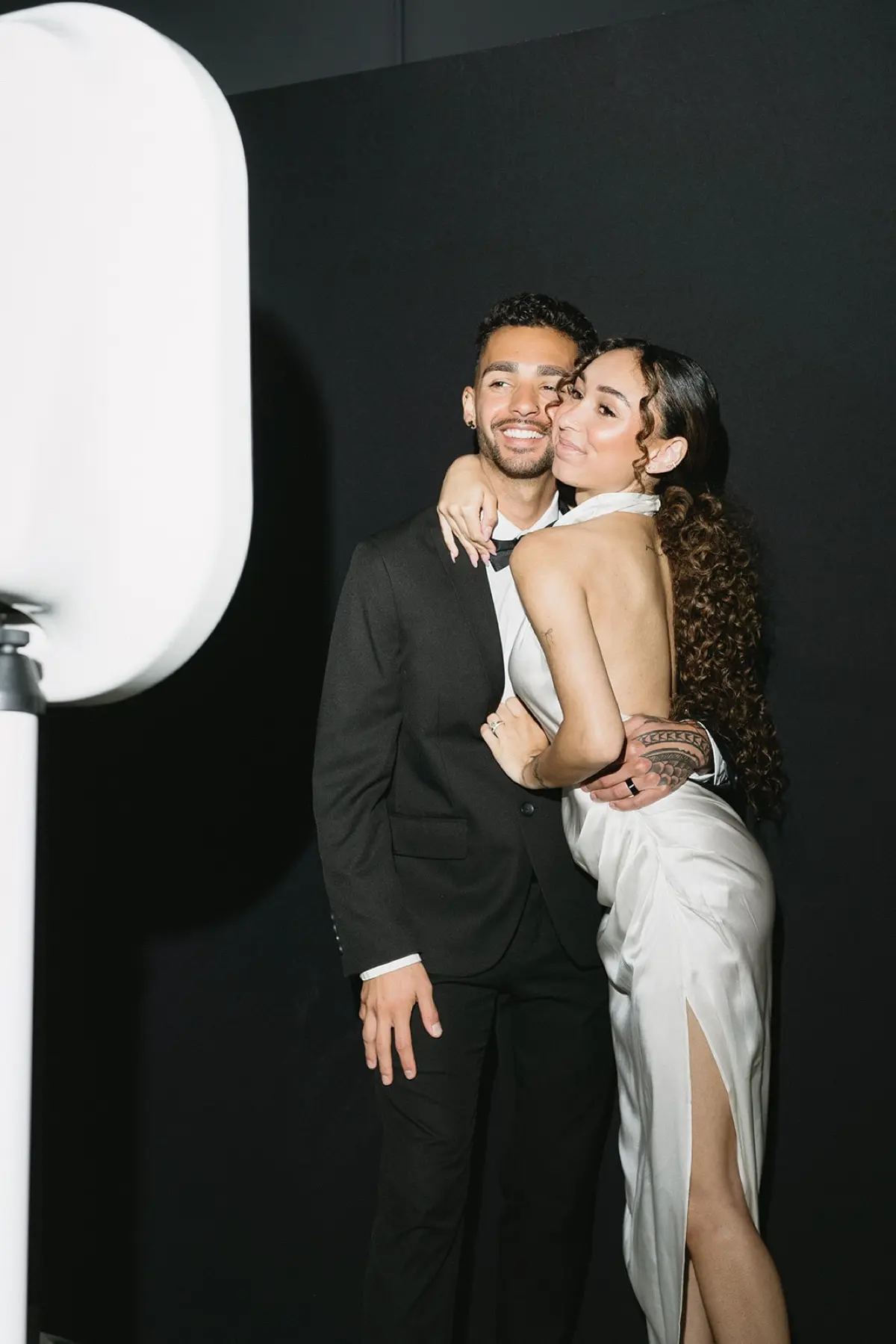 Vibrant salsa-themed open air photo booth with a colorful, festive backdrop
