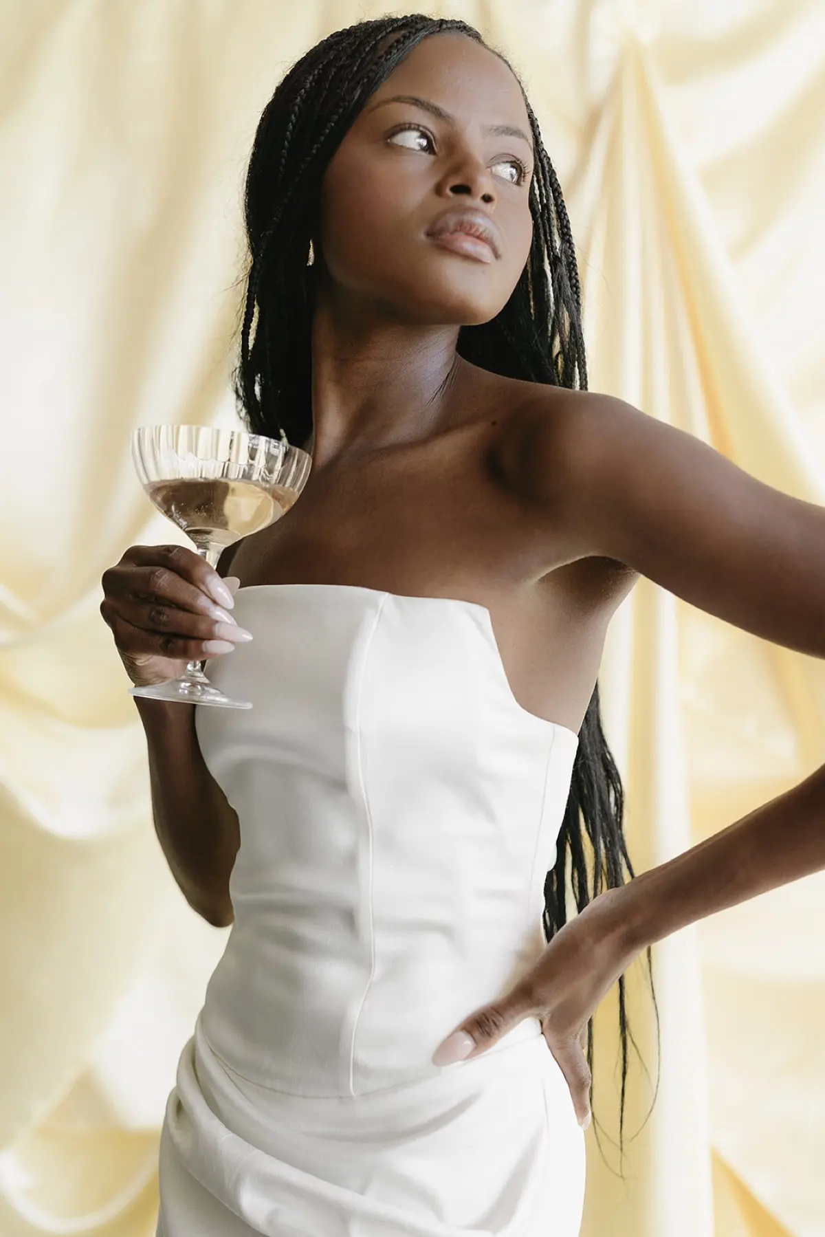 Lifestyle photo booth portrait with gold metallic backdrop featuring guests at a stylish corporate gathering