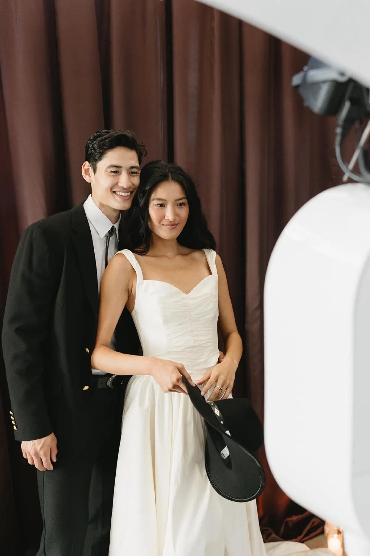 Western-themed photo booth with brown curtain in Los Angeles