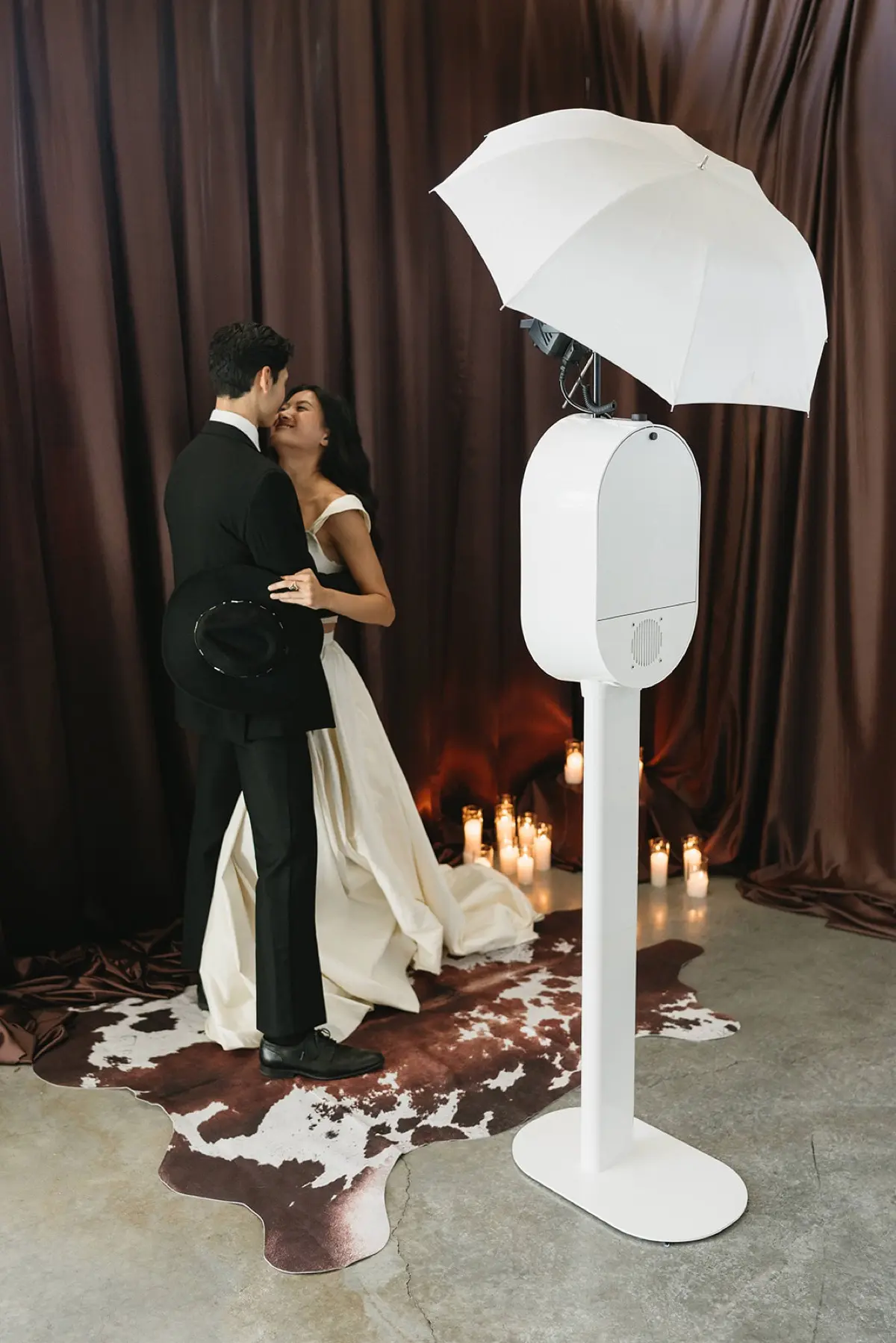Western photo booth with elegant brown curtain in Los Angeles