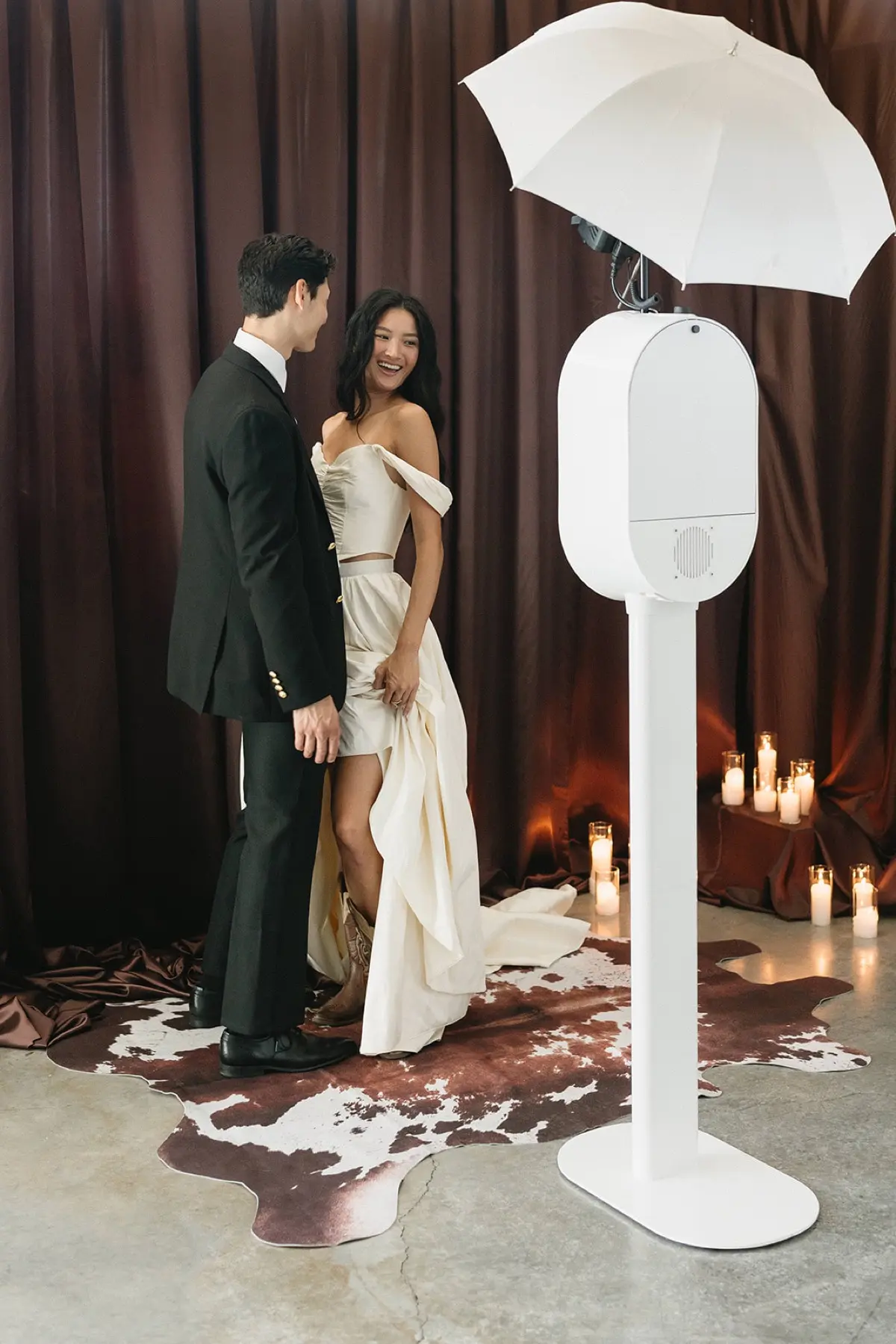 Open air photo booth at a Los Angeles event with brown curtain