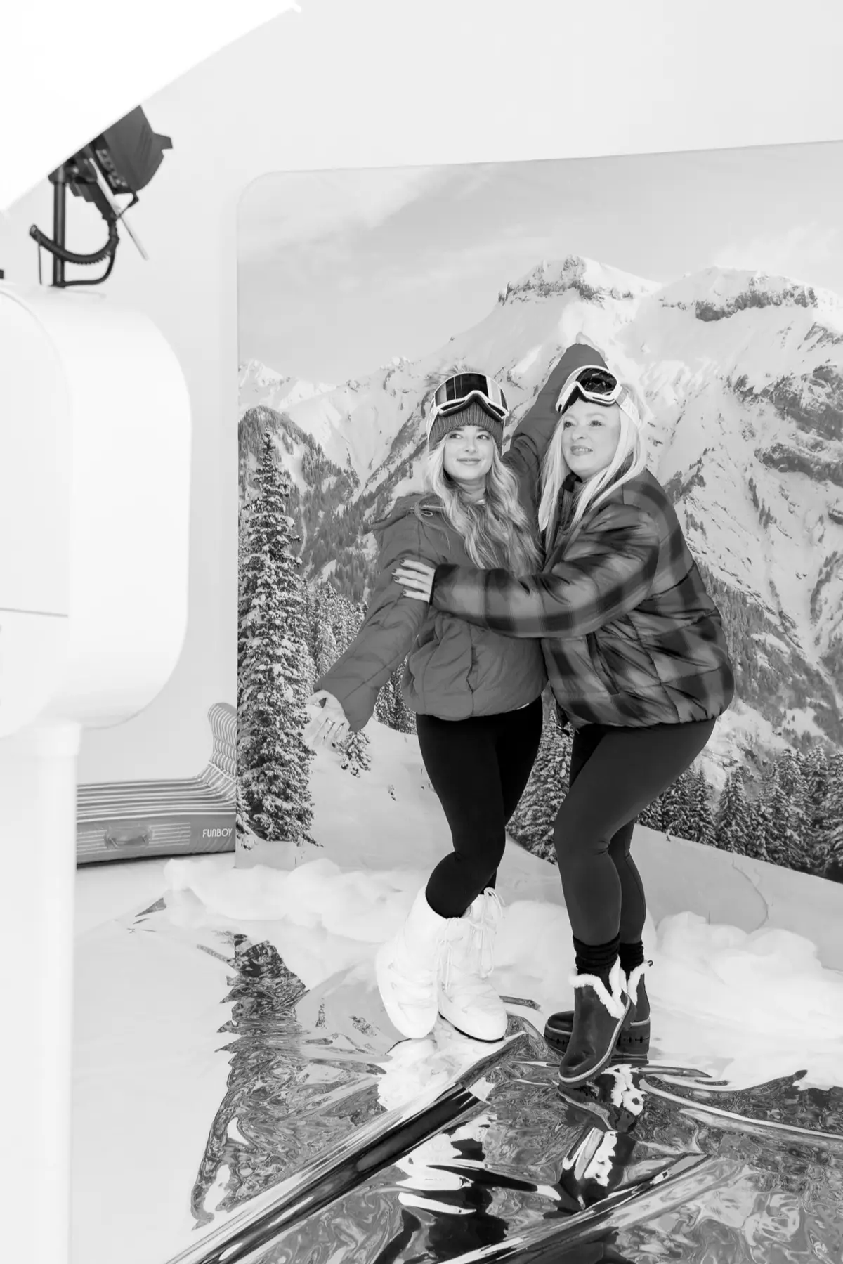 Winter apres ski themed photo booth with cozy festive backdrop at an event